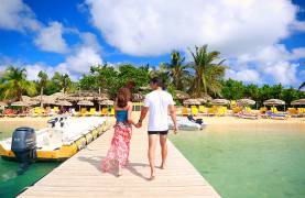 Couple walking on dock in St. Martin
